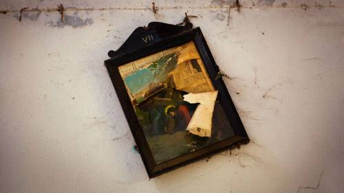 A damaged painting in a vandalized church at a relief camp in the village of Mondesore, Odisha, on A