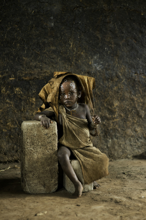 A member of the Suri tribe | Children of the Omo (via stevemccurrystudios)