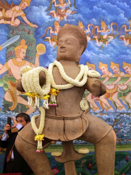 Cambodian dancers perform a blessing dance near the three pieces of the 10th century Cambodian sands