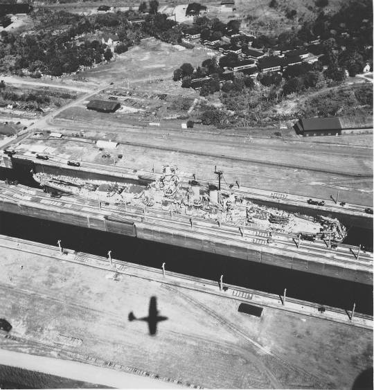 lonestarbattleship:USS North Carolina (BB-55), with Task Force 11, transiting the Panama Canal on return from Pacific combat operations. Photographed on October 11, 1945.Note: the shadow of a Consolidated PBY Catalina, from which this photo was taken