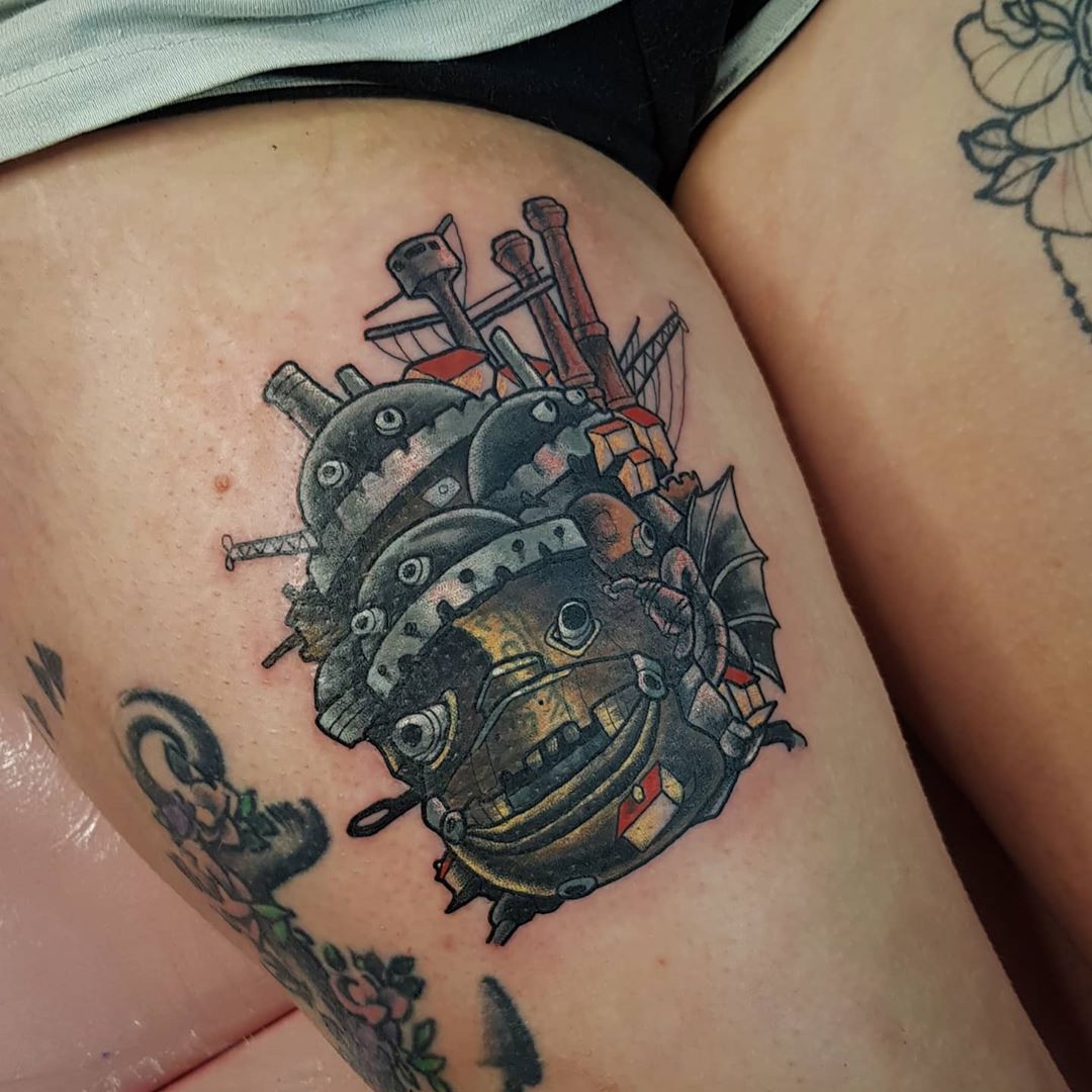 Howls Moving Castle tattoo located on the tricep