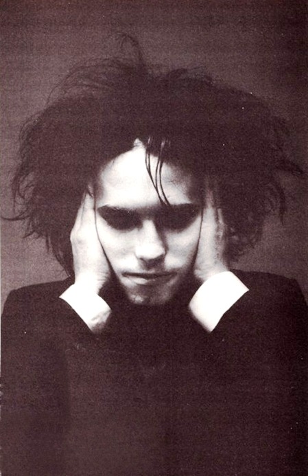 gothtriggers:erato12:A collection featuring Robert Smith, holding his head together.He heard that te