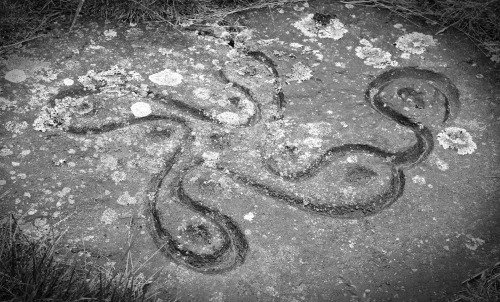 Bronze Age rock art (the unsettlingly named Swastika Stone; a symbol of good luck) and rock craggs, 