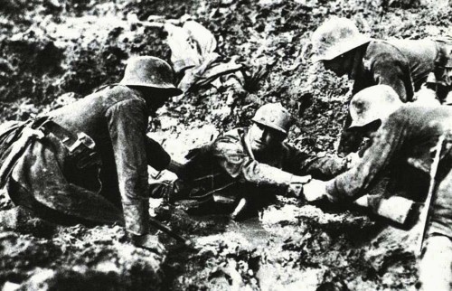 historylover1230: German troops attempting to rescue a French soldier from sinking in a mud hole dur