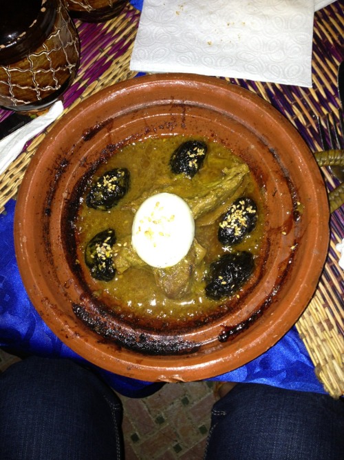 Moroccan tea poured from on high with vegetable appetizers followed by a plum and meat tajine