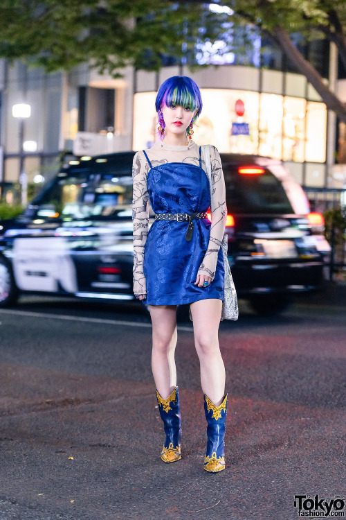 Japanese street style personality Rikarin on the street in Harajuku wearing an X-Girl dress over an 