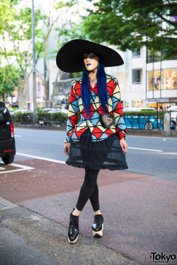 tokyo-fashion:  Japanese fashion buyer Kifujin on the street in Harajuku. He’s wearing a geometric top, sheer hoop skirt, and patent rocking horse shoes all by Vivienne Westwood with a Dr. Martens heart bag and extra wide brim hat. Full Look