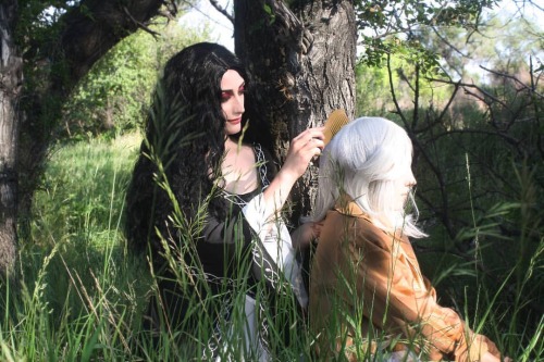 Yennefer brushed the girl’s hair, every now and again snipping off a disobedient wisp with a pair of