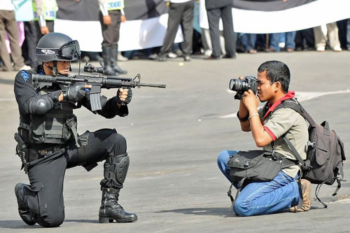 docislegend:  19withbonyknees:  National Geographic photographers are metal as fuck  In the last one, that guy on the left definitely tripped the guy second from the left.