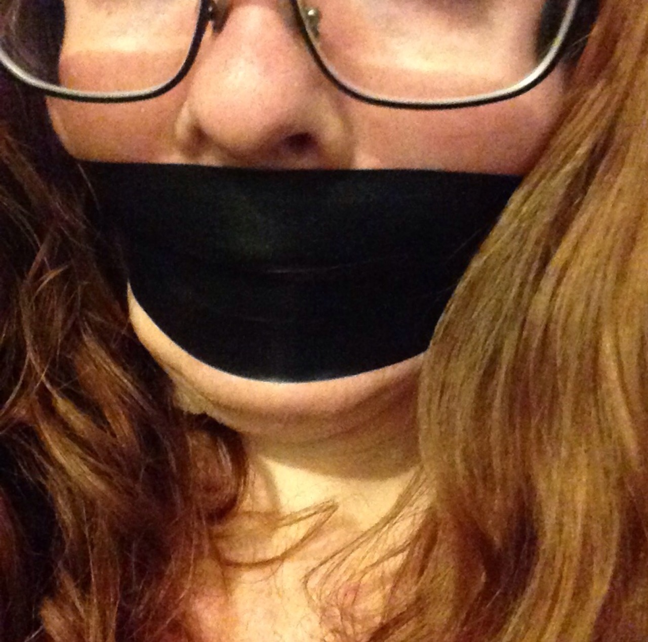 manic-pixie-ginger-slut:  A photo set of me donning the most restrictive tape gag