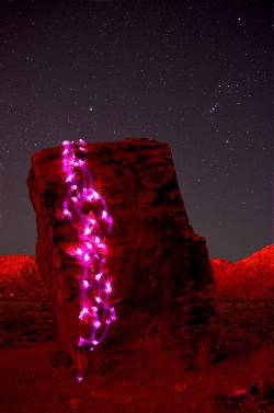 lasvegaslocally:  Rock Climber with Glowsticks