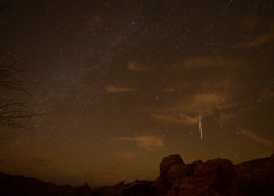   I shot this Saturday night out by Valley of Fire. It is a Taurid meteor. The glow on the bottom of the picture is my camp fire.