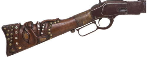 naturepunk:peashooter85:An incredible Winchester Model 1873 lever action rifle carved by the Haida p