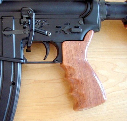 gunrunnerhell:  CustomA CMMG Quebec-A with wooden furniture. The Quebec-A is a dedicated .22 LR AR-15, although I’m not exactly sure why it has that name. I’ve seen wooden stocks for the AR-15 but mostly as a fixed A2 style. It’s interesting to