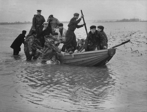 Photographs of the 1953 North Sea floodall taken in the Netherlands, february 1953
• Dikebreach near Papendrecht (X)
• People feeing their flooded villages (X)
• Soldiers rowing survivors to land, Zeeland (X)
• Farmer leading a cow through the...