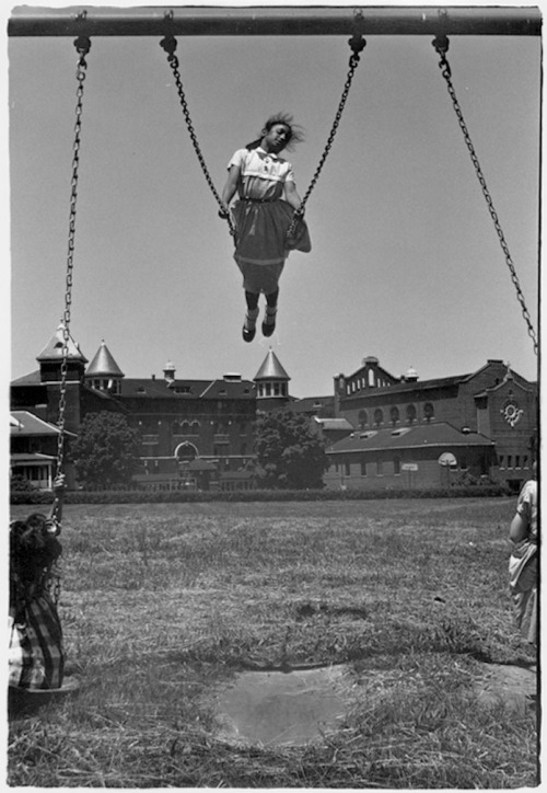 secretcinema1: Girl Swinging in Schoolyard, St. Joseph’s School for the Deaf, c1960, William 
