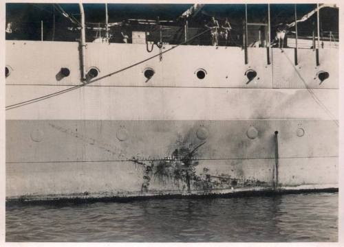 uss-edsall:    Impression of a Ki-51 “Sonia” kamikaze on the hull of County-class heavy cruiser HMS Sussex. The Sonia (reported as a Val, as often happened), is said to have hit the water before hitting the hull, probably losing its bomb in the process.