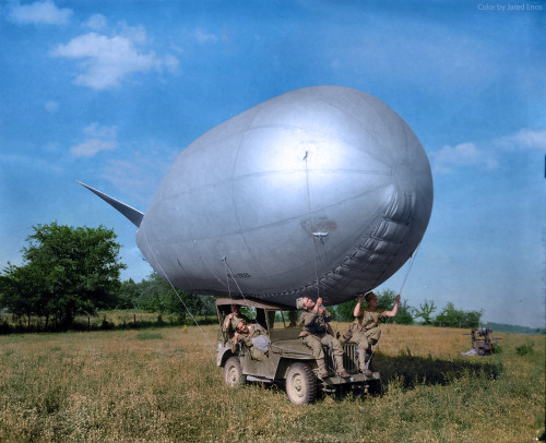 historylover1230:US Army soldiers use a jeep to move a Very Low Altitude barrage balloon in southern