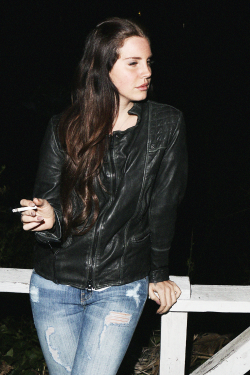  Lana Del Rey outside a motel in Malibu.