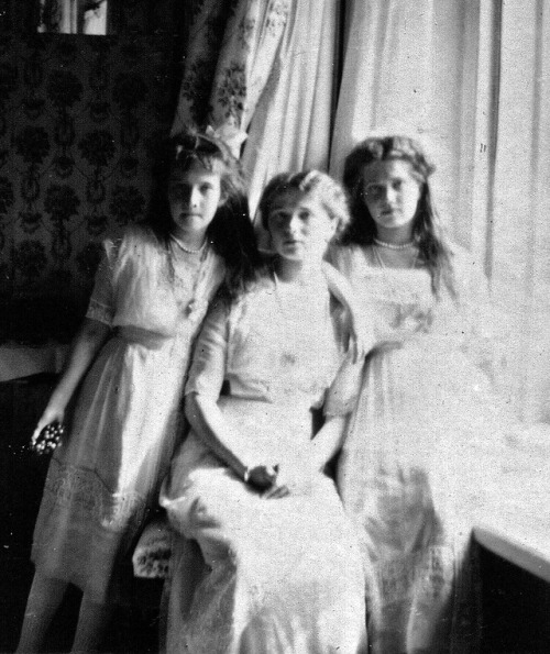 Grand Duchesses Olga, Tatiana, Maria and Anastasia taking a few informal pictures while still dresse