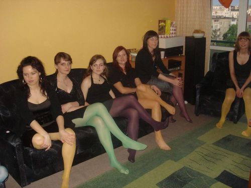 Women in colored pantyhose and short skirt. Woman in pantyhose