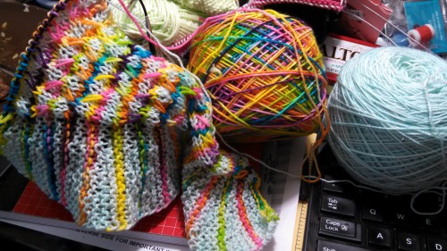 I dyed both skeins specifically for this project. Its my sparkle sock in the powder blue, and a rainbow in my warm toes yarn. This shawl/scarf just may put the rest of my winter neck gear out of business. I am THRILLED with how its working up.