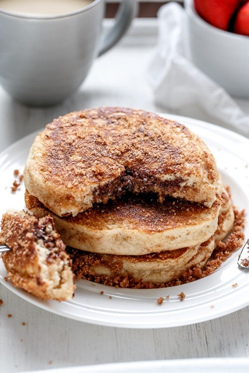chefthisup:  Nutella Stuffed Cinnamon Sugar Donut Pancakes. Get the recipe here &gt;&gt;