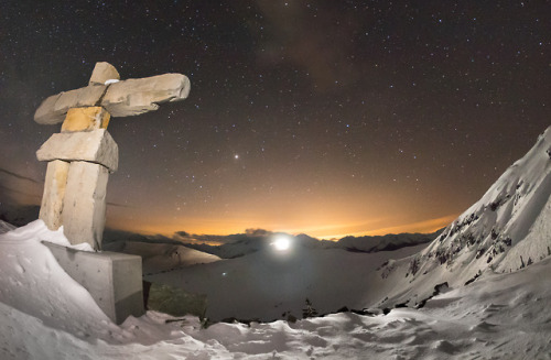 A snowcat’s light illuminating Sunbowl, the inuksuk on Harmony ridge, the stars, and Mars (between t