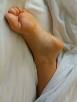 Barefoot sleeping wife