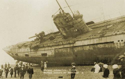 The German submarine U-118, which surrendered at the end of World War I.  The U-Boat was being towed
