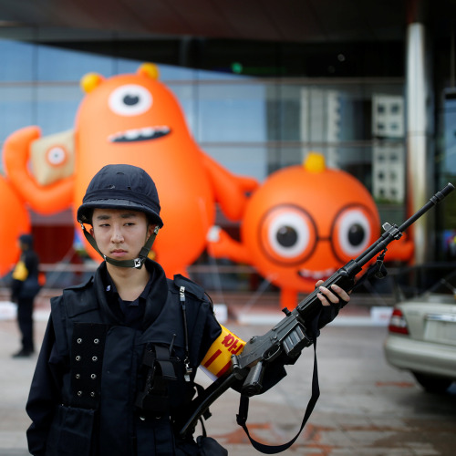 Monster Mash: A South Korean policeman takes part in an anti-terror and security drill at a shopping