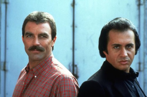 rival style icons: tom selleck versus gene simmons. selleck, literally dressed as the brauny paper t