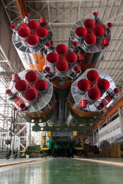 for-all-mankind:  humanoidhistory:  The base of Soyuz solid rocket boosters at the Baikonur Cosmodrome, Kazakhstan, on September 22, 2013. (NASA)  What a great shot of the business end of the Russian Soyuz booster. With 20 engines and over 12 vernier