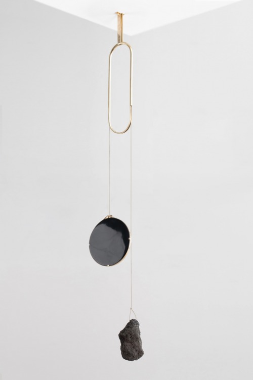 Iddu, 2014Obsidian mirror, lava rock, brass.H150 x W40 cm‘De Natura Fossilium’ by studio Formafantas