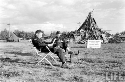 Explorer Scouts guarding a bonfire site(Dmitri Kessel. 1958)