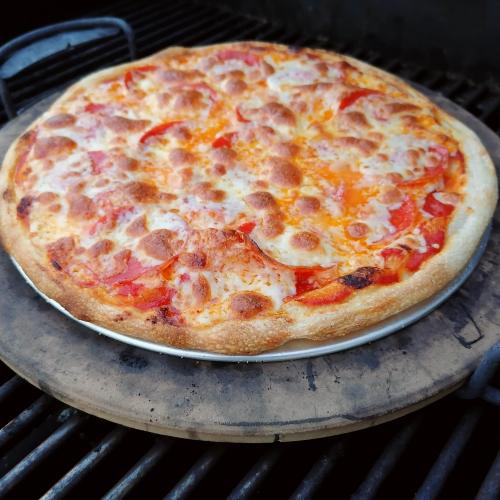 Homemade pepperoni pizza cooked over stone! Check this blog!