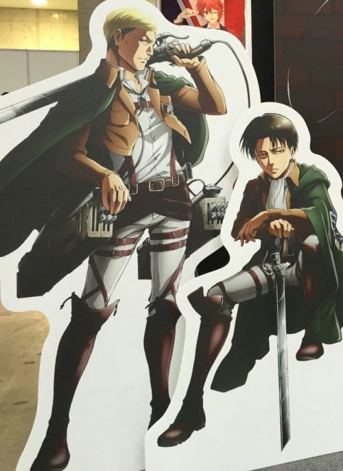 A look at the Shingeki no Kyojin displays at AnimeJapan 2017, such as the inflatable life-size Rogue Titan and cardboard stands featuring the full images of Erwin, Levi, Mikasa, and Eren’s Nanaco collaboration images (Previously seen here)!Update: Added