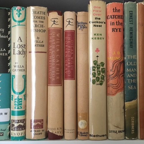 macrolit:A small scene on a shelf, featuring Willa Cather, Ken Kesey, J.D. Salinger, and friends