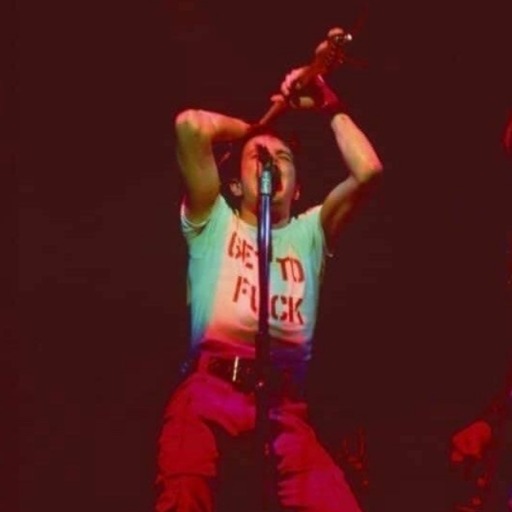 capital-radio-three:Joe Strummer exchanging shirts with a fan at the Rainbow Theatre stop of The Clash&rsquo;s &lsquo;White Riot&rsquo; Tour, May 14th 1977