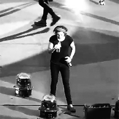 dudski:  Harry gets a fan’s attention as she’s being helped by security. 