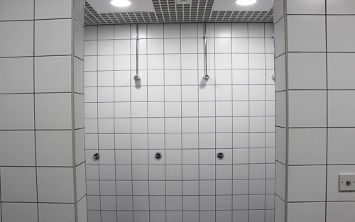 Men’s showers in the dry-side of Flitwick Leisure Centre, Bedford, UK.