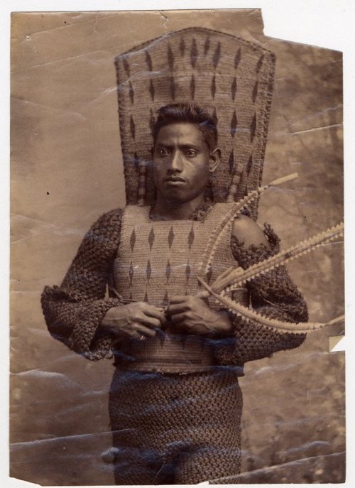 Kirbati warrior in coconut fiber armor with shark tooth weapon, late 19th century.from The British M