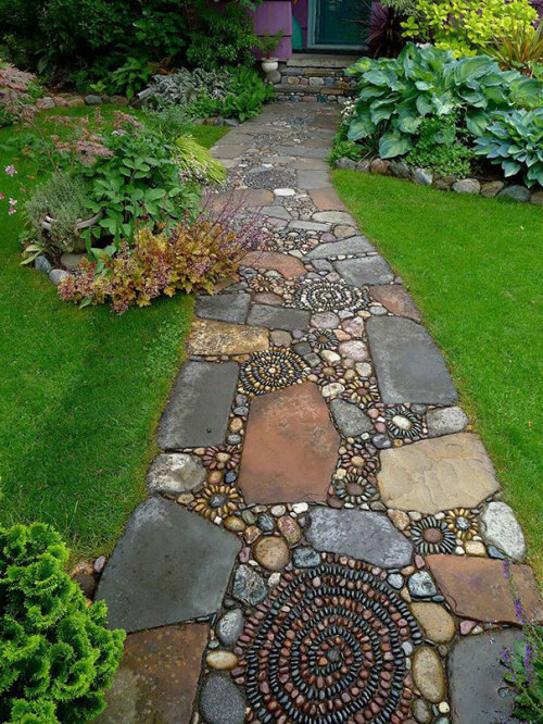 asylum-art:  10 Magical Pebble Paths That Flow Like Rivers   The garden or back-yard is one of the best places in a home for the home-owner to express their creative side. Why surround all those beautiful plants with an ugly path when you can create a