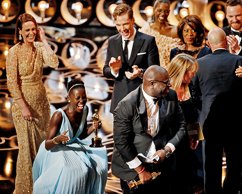 delevingned-deactivated20151023:  The cast and crew of ‘12 Years a Slave’ celebrate after winning the Best Picture award onstage during the 86th Annual Academy Awards 