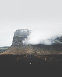 benjaminhardman:  Fall hues. Forever feeling drawn to this mountain. Jutting out of the landscape, it obstructs the road from both directions. There’s always incredible clouds brought over from the surrounding glaciers, morphing naturally to its shape.