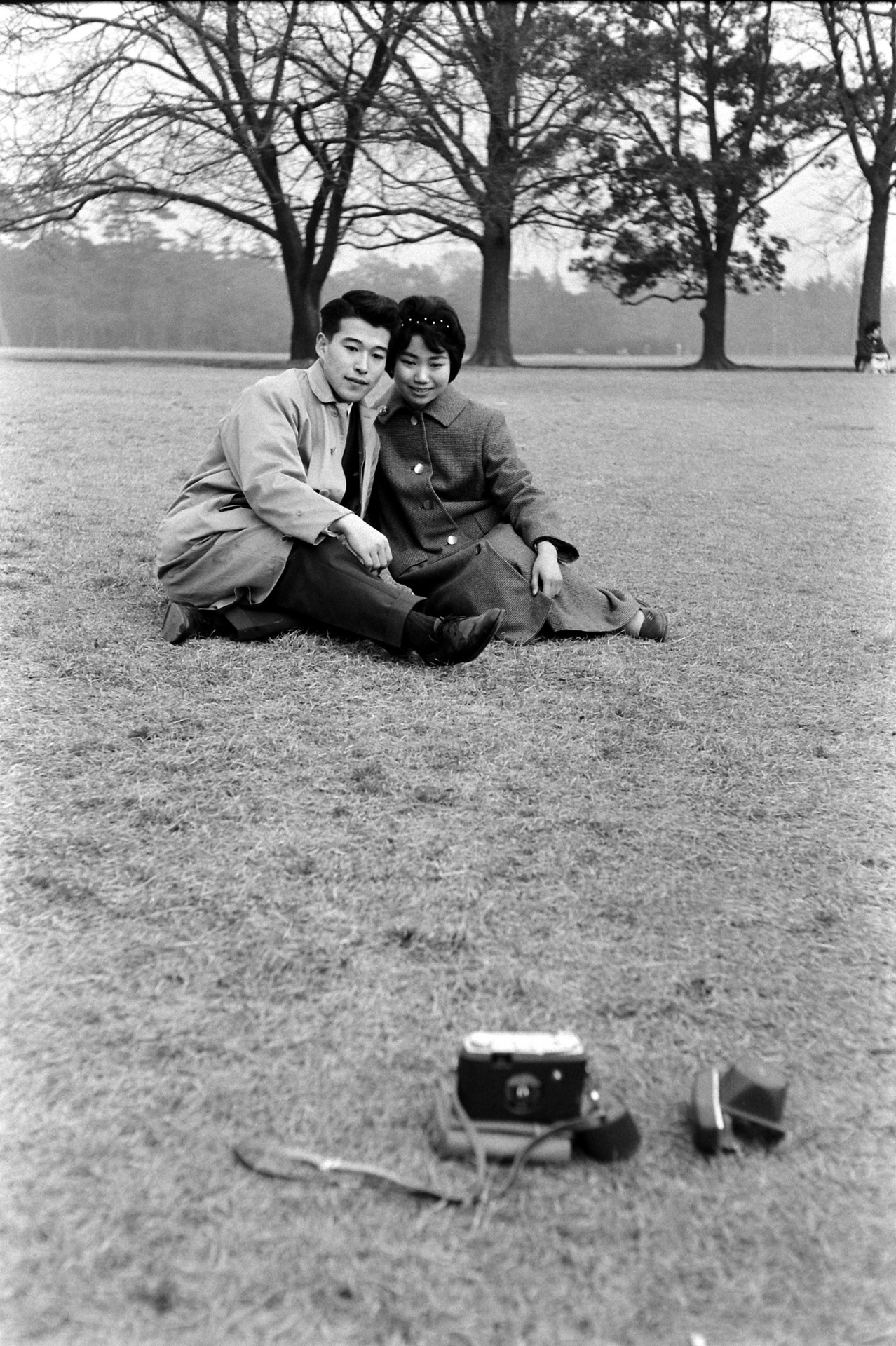 s-h-o-w-a:A young couple takes a selfie on a self-timer on their camera, Japan, 1959Ph.