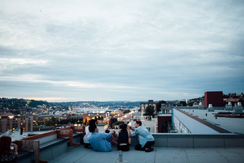 purifiant:  jakfruit:  My friends all lined up on the roof, just minutes before Seattle’s annual firework show.  yesss my city 