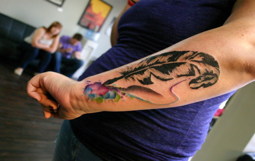 fuckyeahtattoos:  Quill pen with watercolor bursts by Leah Williams, Ananda Art and Tattoo in Denver, CO.