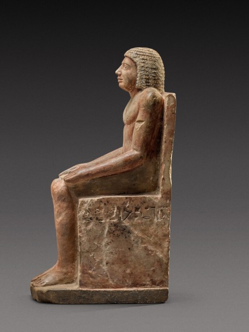 An Egyptian Polychrome Limestone Figure of Hem-Min6th Dynasty, 2360-2195 B.C.Inscribed &ldquo;Tr