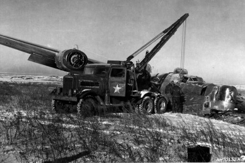 An American 7.5 ton recovery vehicle works on a B-24 that crash landing near Poltava, Ukraine, durin